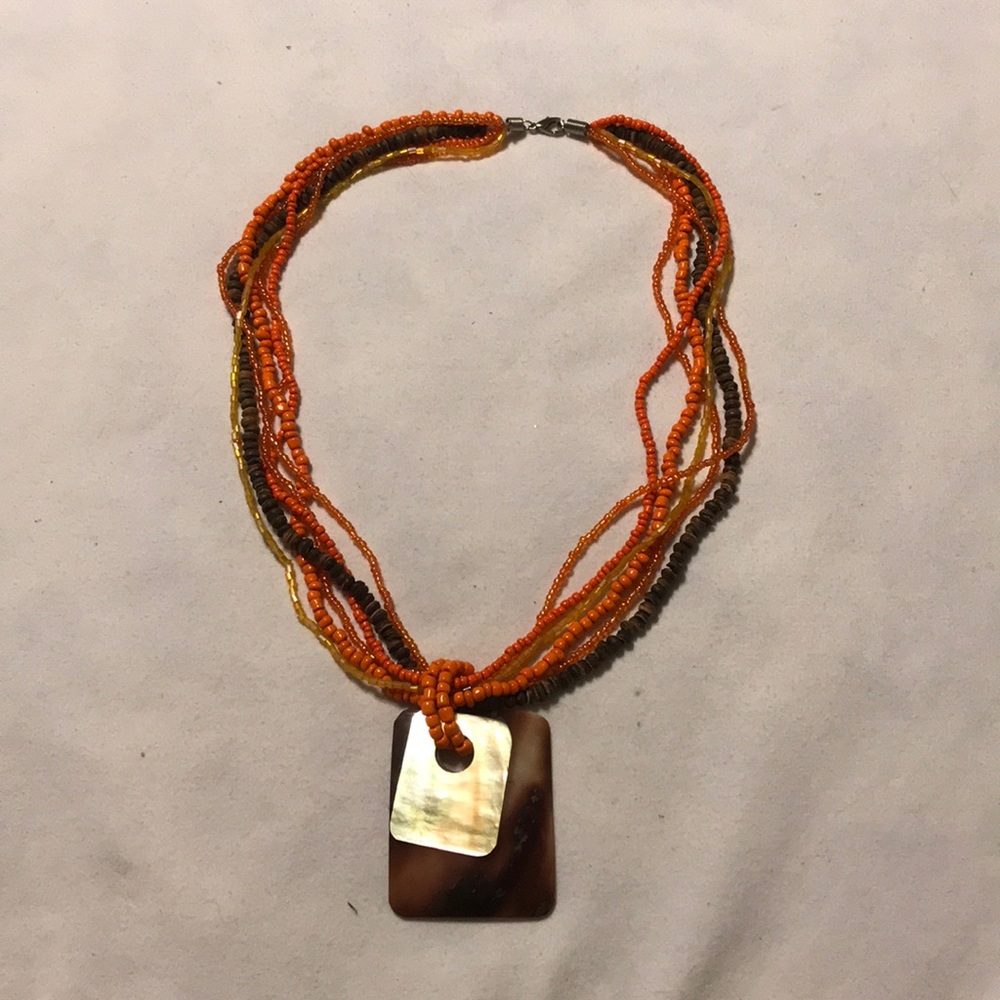 Necklace. Multi strand seed bead with 2 pendants